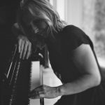 Close-up view of Anne at the keyboard