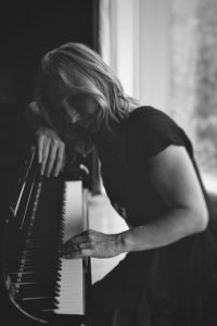 Close-up view of Anne at the keyboard