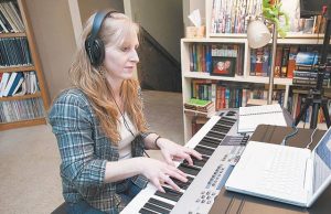 News-Register feature photo of Anne working at the keyboard