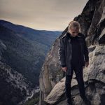 Anne standing on the edge of a cliff in Yosemite National Park