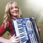 Anne playing her shiny blue accordion
