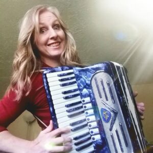 Anne playing her shiny blue accordion