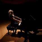 Anne performing on the concert grand piano at Linfield College